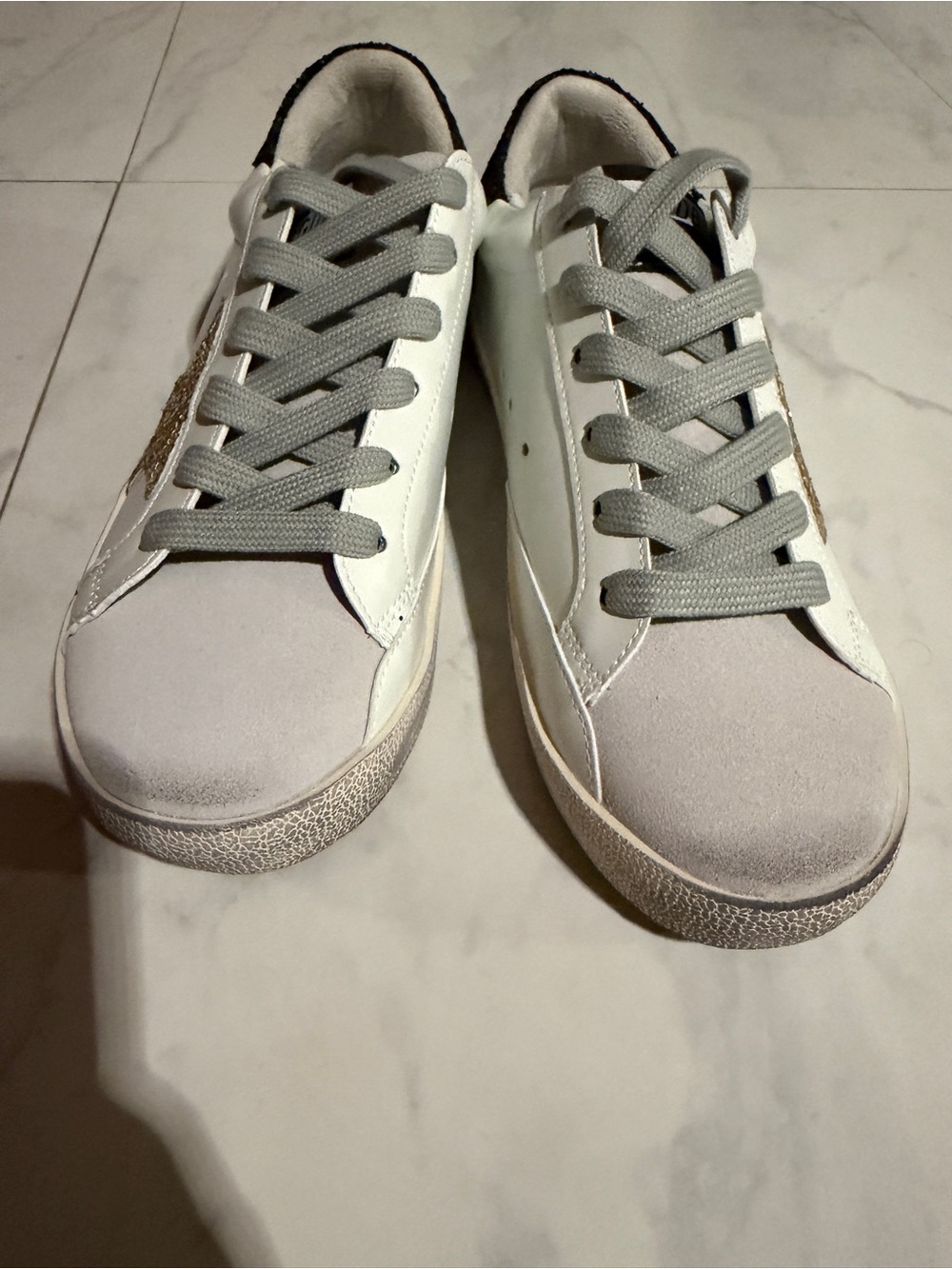 White & Gray Low-Top Sneakers with Gold Accent